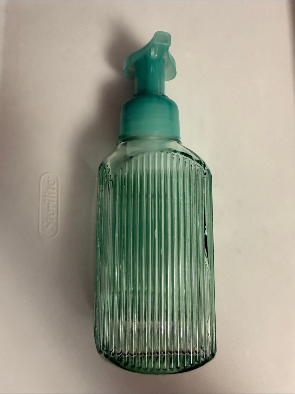Bath and Body Works light green ribbed glass foaming soap dispenser.